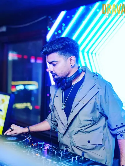 A focused moment behind the decks at Drava Lounge. I believe a great set is about precision and feeling the room, skills I bring not just to live events but also to crafting custom tracks that are perfectly mixed and engineered for a club sound system.