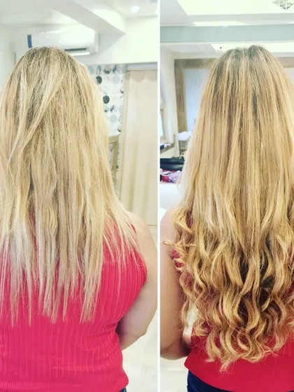 For this blonde client, we added both length and volume. The extensions were then styled into loose curls, creating a glamorous and full-bodied final look.