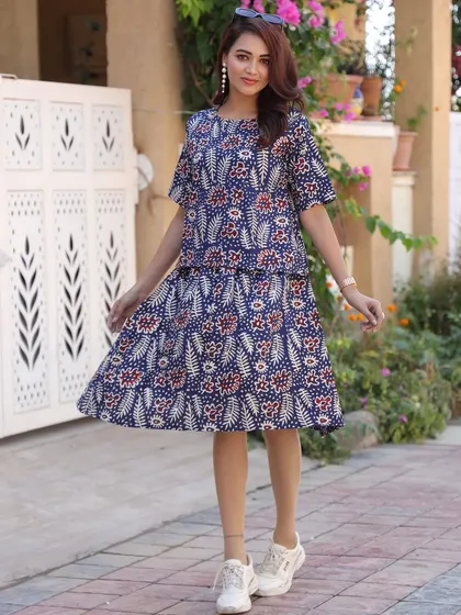 A vibrant indigo co-ord set with a red and white floral motif. This versatile set can be worn together or as separates to create multiple outfits.
