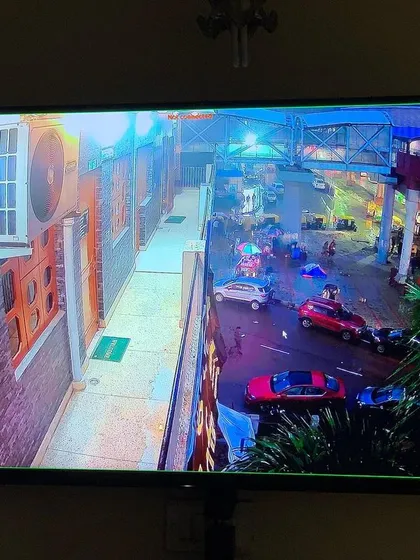 A single camera view showing a street at night with excellent color night vision.