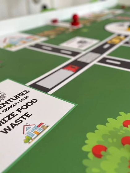 A glimpse of the IRO Innovators category mat, themed "Minimize Food Waste." This challenge for ages 7-10 focuses on creating robotic solutions for a sustainable food chain.