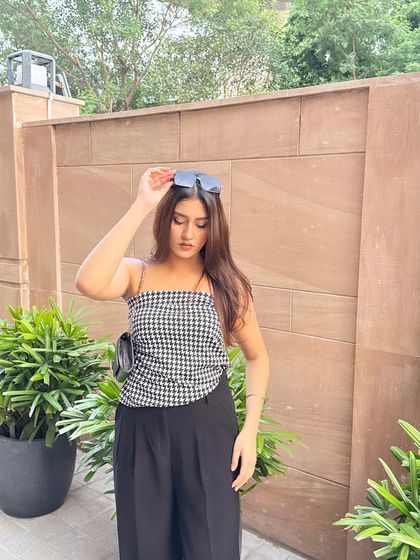 Adjusting my sunglasses, a classic influencer pose.