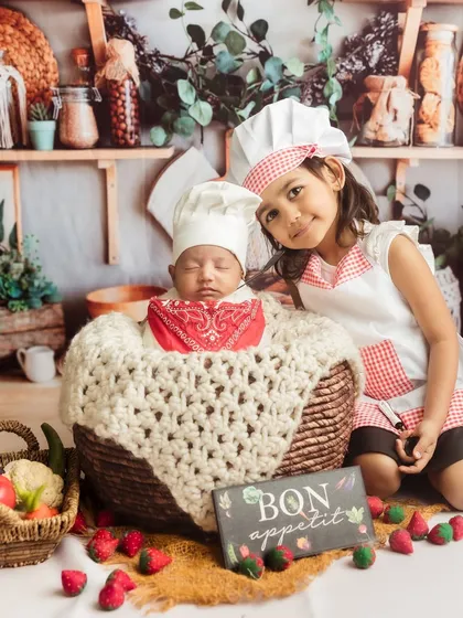 A big sister welcomes her new sous-chef. I love incorporating newborns into themed shoots with their older siblings.