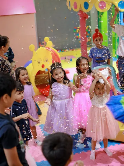 A shower of confetti makes for a magical and photogenic moment. The looks of delight on the children's faces say it all.