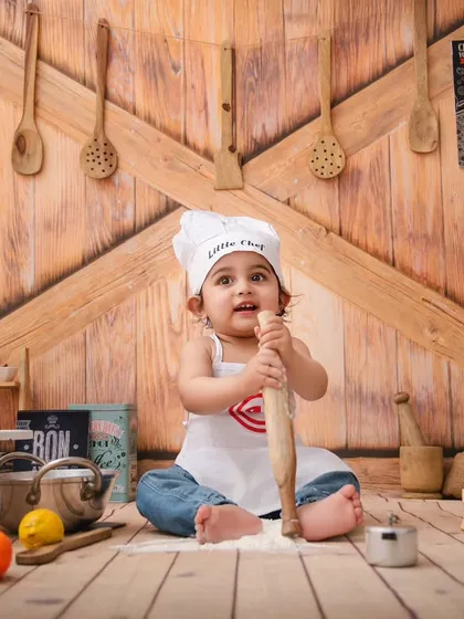 Little chef Vivaan is hard at work with his rolling pin, creating some kitchen magic in this fun and interactive setup.