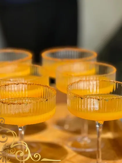 Sunset-tinted cocktails with a spiced masala rim. This is my take on a classic cocktail with an Indian twist, adding a bit of zing to every sip.
