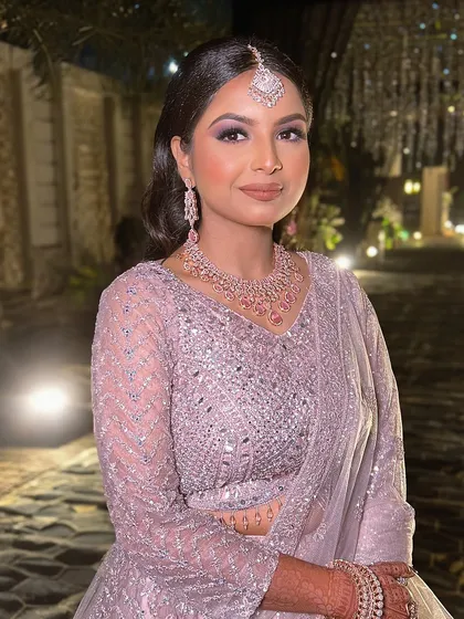 A beautiful portrait of Swati at her Jaipur engagement. We created a stunning look with purple smokey eyes and a soft pink lip to match her lilac lehenga.