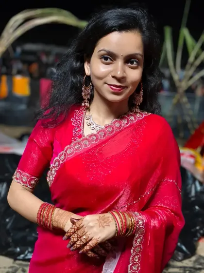 A beautiful client dressed in red for Chhath Puja, with her simple and elegant mehndi adding to the festive glow.