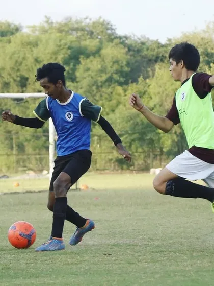 You can't be motivated every day, but you can be disciplined. An action shot from a competitive game, showing players in the heat of the moment.