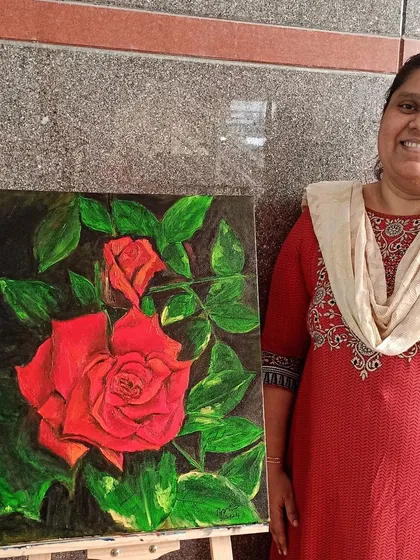 Dr. Aqila proudly stands with her realistic oil painting of a red rose. In this piece, she mastered the art of slow blending and layering, which is unique to oil paints, to create the soft, velvety texture of the petals.