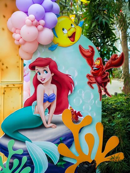 A detailed prop of Ariel, Flounder, and Sebastian from The Little Mermaid, perfect for an underwater theme.