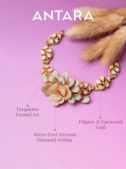 This 22KT matte gold necklace is wearable art. It blends intricate filigree with openwork craftsmanship, blooming into a floral design with turquoise enamel that’s bold, modern, and made to stand out.