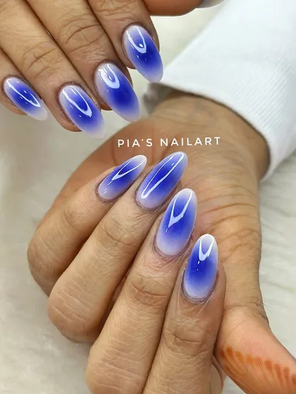 Deep blue aura nails. The airbrush technique creates a beautiful gradient effect that looks like a glowing aura on your fingertips.