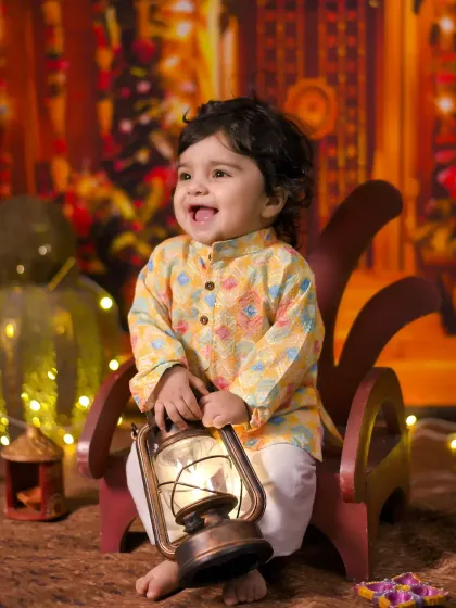 A joyful smile lights up this Diwali-themed photoshoot. I use lanterns and warm lighting to capture the true spirit of the festival of lights.