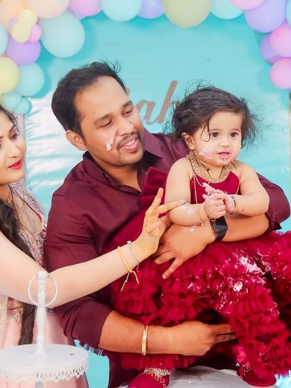 The cake smash is a highlight of any first birthday. We capture the pure joy and mess as the family encourages their little one to take her first bite of birthday cake.