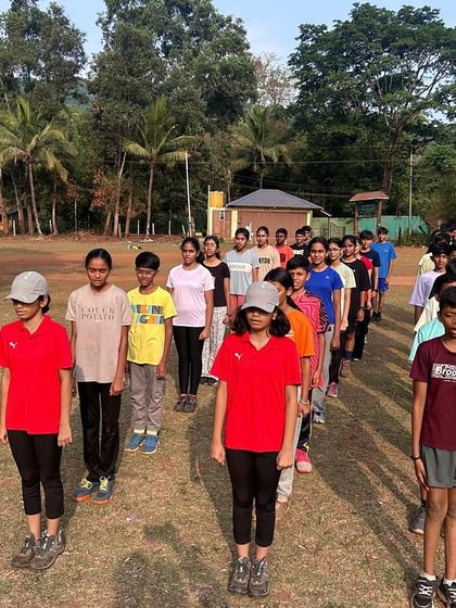Campers stand in disciplined lines for the morning assembly at Dandeli, a routine that helps instill time sense and order.