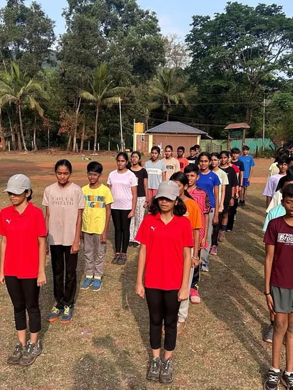 Campers stand in disciplined lines for the morning assembly at Dandeli, a routine that helps instill time sense and order.