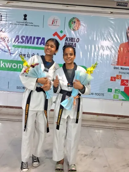 Two of our black belt athletes, all smiles after competing in the Asmita Taekwondo City League.