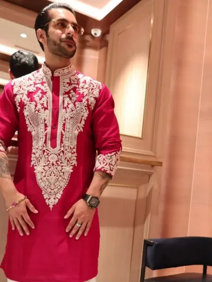 The full look of the red kurta, showing its confident and festive vibe.