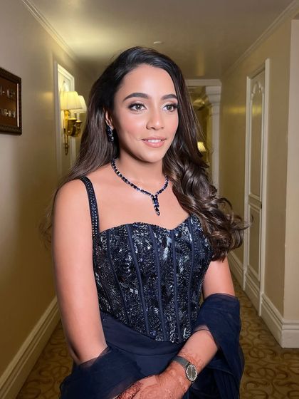 This muse was effortlessly stunning, making my job easy. For her cocktail look, we chose a deep blue jewel-toned outfit and paired it with a sultry smokey eye and glowing skin for a breathtaking result.