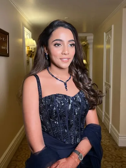 This muse was effortlessly stunning, making my job easy. For her cocktail look, we chose a deep blue jewel-toned outfit and paired it with a sultry smokey eye and glowing skin for a breathtaking result.