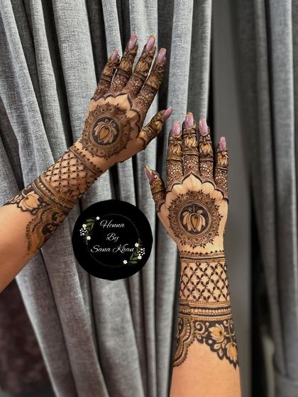 Another view of the elegant lotus mandala design, showcasing its symmetry and the clean, geometric patterns on the wrists.