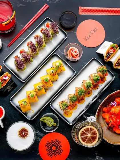 This large, dark, and moody flatlay for a high-end restaurant showcases an entire spread of sushi and cocktails. This type of shot is perfect for menu covers or promotional banners, demonstrating my ability to style complex, multi-item scenes that feel luxurious and appealing.