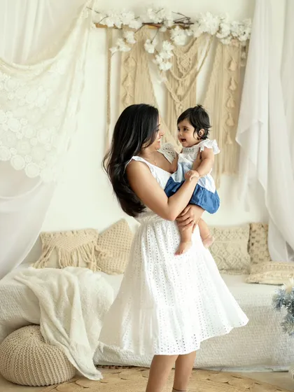There is nothing more beautiful than a mother's love. In this moment, set against a dreamy boho backdrop, you can feel the pure connection and happiness shared between mother and child.