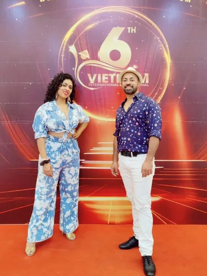 Sai and I on the red carpet in Vietnam. We love representing the Indian Latin dance community on a global platform.