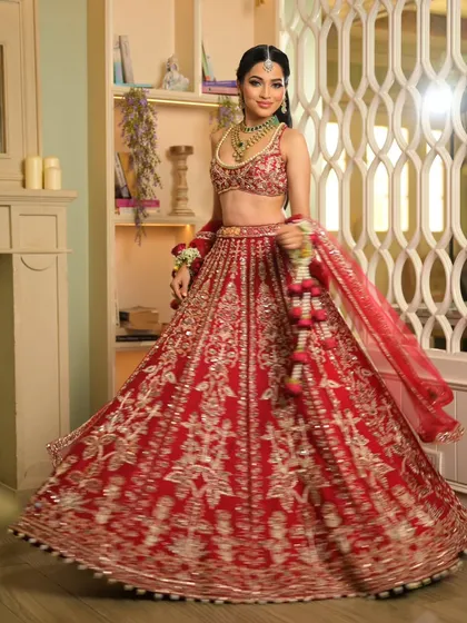 A twirl that shows off the incredible volume and craftsmanship of the bridal lehenga. I ensure my drapes are secure enough to handle every happy dance and celebratory moment.