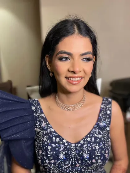 A confident smile from my client, ready for her reception. The bold eye makeup is balanced with a neutral lip color for a sophisticated finish.