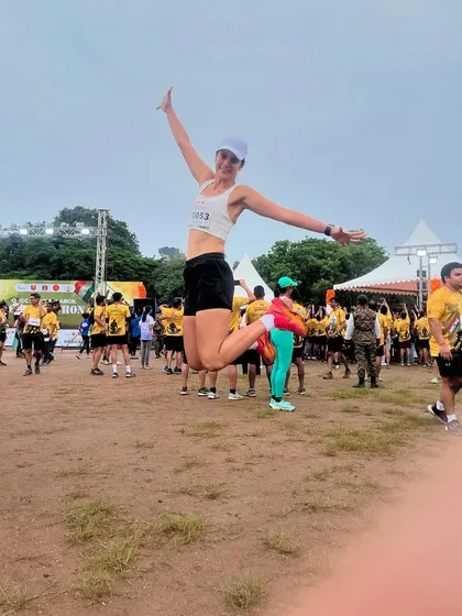 The pure joy of finishing a race! This jump captures the feeling of accomplishment and freedom that running gives us.