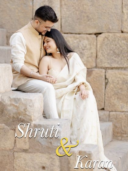 A sweet and tender moment captured on the steps of a historic site. The soft smiles and gentle hold create a heartwarming portrait that feels both natural and beautifully composed.