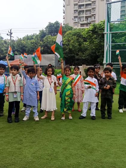 Young students wave the Indian tricolor with pride on our school grounds. We encourage our students to express their love for the country and celebrate our national identity.