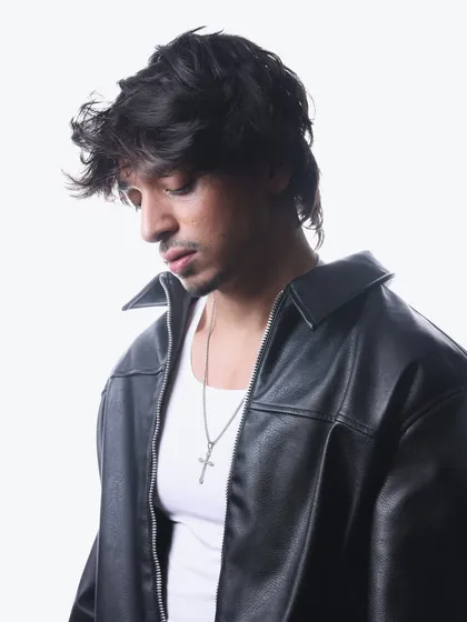 A candid, thoughtful pose from my 2025 press kit shoot. It shows a different, more introspective side to my personality.