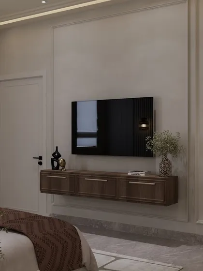 Another view of the floating TV console, framed by classic wall molding. The design focuses on clean lines and thoughtful functionality.