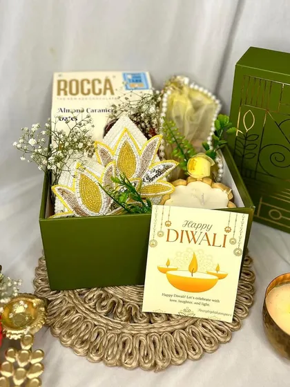 I take great pride in my corporate gifting, helping businesses share joy with their clients and employees. This elegant Diwali hamper shows how I can incorporate festive elements like lotus hangings and diyas into a professional and memorable gift.