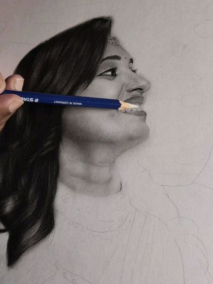 A detail shot showing how I use a sharpened pencil to define the teeth and create a realistic smile.