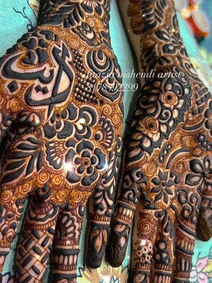 Another angle of the 'Ayat' design, showing the intricate patterns surrounding the name.