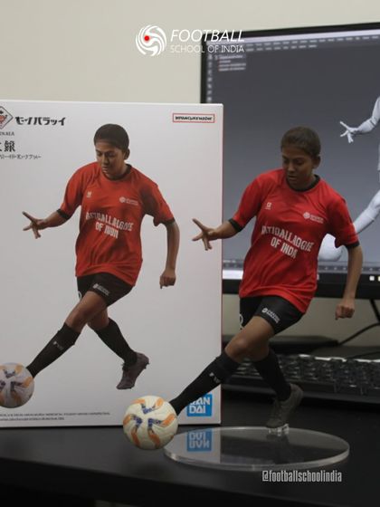 A player in our red kit is transformed into a collectible figurine, a fun tribute to our stars.