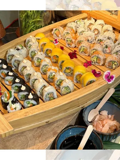 Our sushi boat, ready to set sail at your next event. The combination of colorful rolls on the natural wood boat makes for a stunning presentation that always impresses guests.
