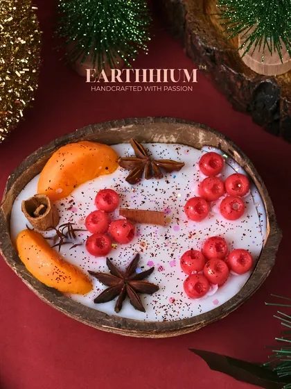 My 'Tropical Noel' candle brings a unique twist to Christmas decor, set in a real coconut shell with festive spices and berries.