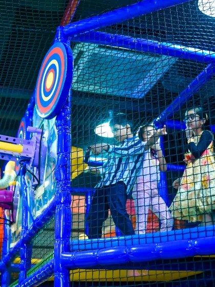 Taking aim with our soft ball shooters is a favorite party activity. It's a safe and exciting game located within our multi-level play maze.