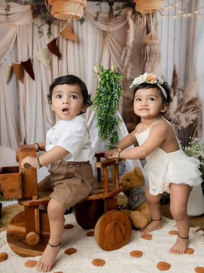 A brother and sister playing together in my boho-themed studio setup.