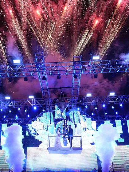 A grand finale moment at the Sangeet, with the couple on a hydraulic lift surrounded by smoke and a spectacular fireworks display. This is how you end the night with a bang.