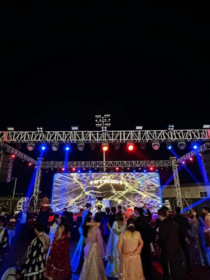 A glimpse of the massive scale I can handle. This two-day wedding at Courtyard by Marriott Aravali featured a full concert-style production with a huge lighting rig and LED wall to match the crazy energy.