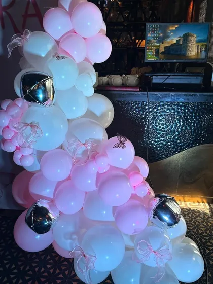 A detailed look at the balloon clusters created for the half-birthday party, showing a mix of different sizes and textures.