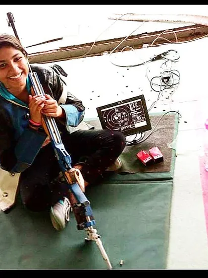 Our star shooter Kanishka taking a moment during a training session with her Feinwerkbau air rifle. The electronic target shows her precise shot.