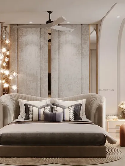 This bedroom is sculpted for serenity with soft curves and soothing vibes. From the walls to the ceiling, the seamless flow of curved forms and a contrasting sculptural chair bring a calm that you can feel.
