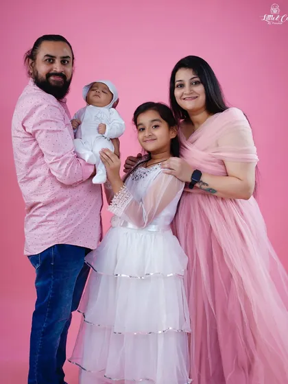 A slightly different pose from the same family session, showing the love and connection between all four family members.